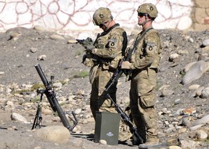 File - U.S. Army Sgt. Clint Reentz, left, and Pvt. Scott Gentz, with Charlie Company, 1st Battalion, 133rd Infantry Regiment, set up a mortar system in Lowkar, Nuristan province, Afghanistan, Nov. 10, 2010. Charlie Company, based at Forward Operating Base Kala Gush, works with the Nuristan Provincial Reconstruction Team to improve security in eastern Afghanistan.