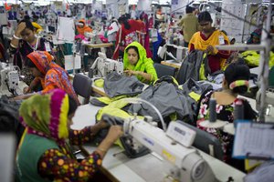 In this April 19, 2018 photo, Bangladeshis work at Snowtex garment factory in Dhamrai, near Dhaka, Bangladesh.