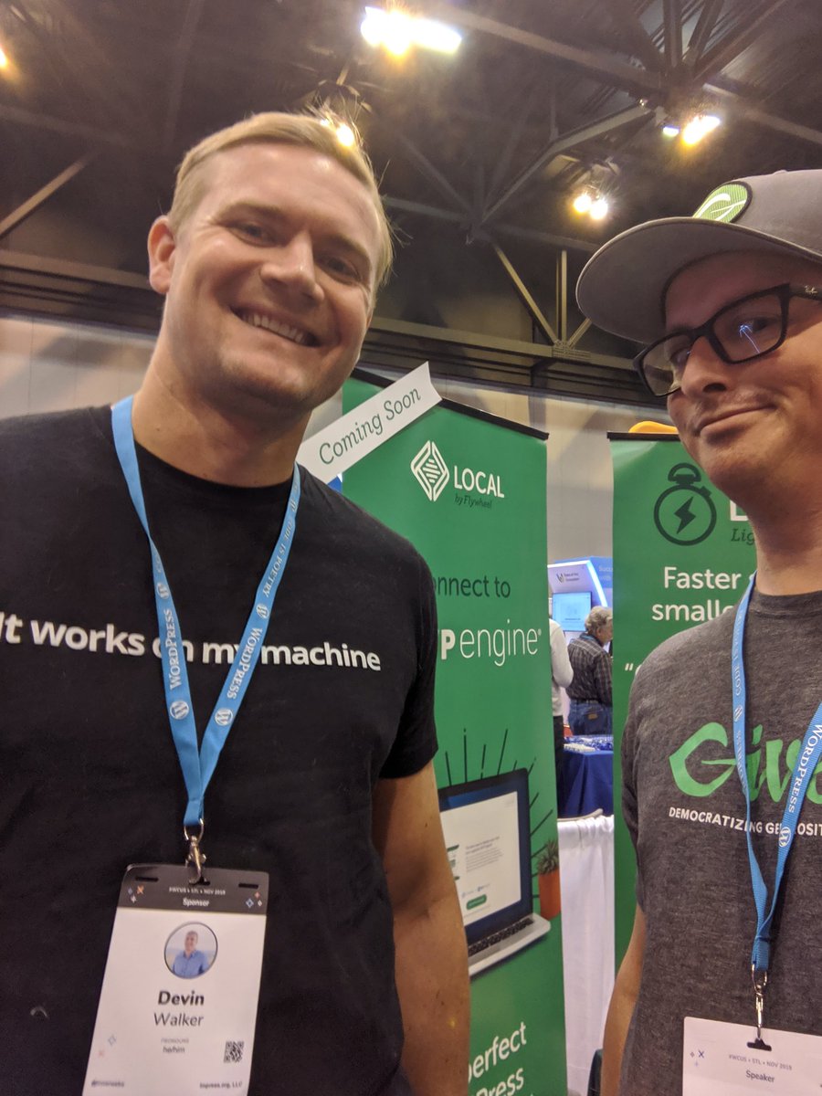 Devin standing beside me in a selfie. He's wearing a black t-shirt with "It works on my machine" in white on the front. I'm making a SMH face.