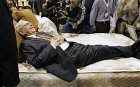 Billionaire investor Warren Buffett strikes a pose on a mattress during the annual Berkshire Hathaway shareholders meeting, in Omaha, Neb., Saturday, May 5, 2007.