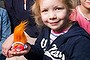 Rowena Gray with her children (from left) Emily, 9, Natalie, 4, and Rebecca, 6, holding toys they received in a children's fast food meal. 