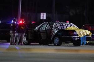 Authorities investigate the scene of a shooting Thursday, Dec. 5, 2019, in Miramar, Fla