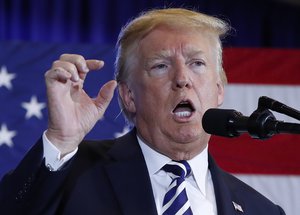 President Donald Trump gestures while speaking at the Harris Conference Center in Charlotte, N.C., Friday, Aug. 31, 2018