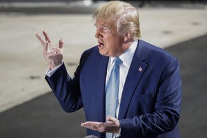 President Donald Trump gestures while speaking to the media on the South Lawn of the White House in Washington, Friday, Oct. 4, 2019, before his departure to nearby Walter Reed National Military Medical Center in Bethesda, Md.