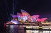 The sails of the Opera House are lit up with an animated Austral Flora Ballet by Andrew Thomas Huang.