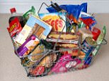 Jacqui Mattholie, with a shopping basket full of organic food. Good Health feature: Junk food versus Organic. Jacqui, 40, is married to Maurice, 52, a senior executive for an IT company. They live with their twin four-year-old daughters, Grace and Amelia, in Camberley, Surrey. Jacqui says: 'I used to love cooking-but once I had the twins, I suddenly found I had very little time to shop and cook. I started to rely on ready-meals and convenience foods-and it's now become a habit that's hard to break. While I try to make sure we get our five portions of fruit and veg a day, and avoid junk food, ready meals are pretty much all we eat. Because we don't have a farmer's market or many local shops that specialise in organic food, I decided to rely on supermarket organic ranges and organic box schemes. I went online and ordered an organic meat box from Eversfield Manor Farm, and an organic fruit and veg box from Abel & Cole. I loved their websites, because they explain where everything si sour