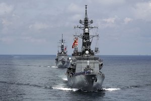 In this June 26, 2019, photo, Japan's Maritime Self-Defense Force (JMSDF) destroyers JS Murasame (DD-101), front, and JS Akebono (DD-108) participate in a drill off the coast of Brunei.