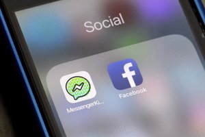 Facebook and Facebook's Messenger Kids app icons are displayed on an iPhone in New York, Friday, Feb. 16, 2018.