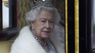 The Queen on her way to reopen British Parliament. 