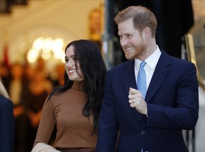 Britain's Prince Harry and Meghan, Duchess of Sussex leave after visiting Canada House in London, Tuesday Jan. 7, 2020, after their recent stay in Canada