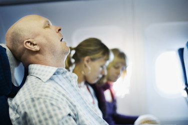 Man snoring on plane