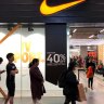 Shoppers queue outside a Nike store in Melbourne for the Black Friday sales. The sales help lift retail sales in November but doubts remain about whether this will be carried through to December results.