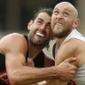 Brodie Grundy with teammate Ben Reid at Collingwood training.