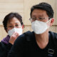 Passengers from Wuhan arrive at Sydney Airport wearing masks. 