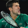 Novak Djokovic celebrates after winning the men's singles semi final against Roger Federer. 