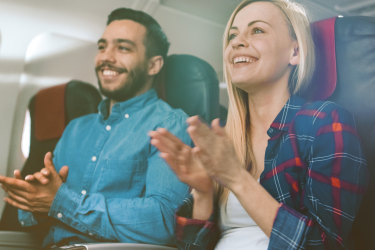 clapping plane passengers