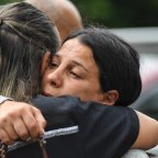 Leila Abdallah being comforted on Monday morning before addressing the media.