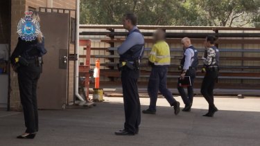 The man is arrested by police at his current workplace on Wednesday, March 4. Picture: 