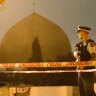 A policeman stands guard at the Al Noor Mosque ahead of a national call to prayer after the shootings.