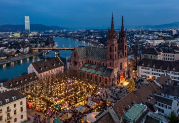 CHRISTMAS MARKETS, BASEL, SWITZERLAND: The sweet aroma of mulled wine and roasting chestnuts drifts through the crisp ...
