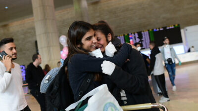 Israelis arrive at Ben-Gurion International Airport in Tel Aviv from South America, where they were temporarily stranded as a result of the coronavirus epidemic, on March 20, 2020. Photo by Tomer Neuberg/Flash90.