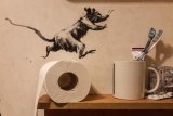 Banksy follows stay-at-home orders and makes bathroom art during coronavirus crisis.