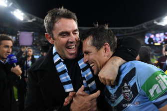 NSW coach Brad Fittler congratulates his halfback Mitchell Pearce after the Blues' series win last year.