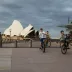 Bike riders take a spin around Circular Quay, which is usually filled with crowds.