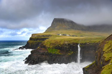 High angle view of the small village Gásadalur and the Mulafossur waterfall in the foreground on a sunny day on Faeroe Islands. SatSept28FaroeIslands - Faroe Islands - Jamie Lafferty
iStock image for Traveller. Re-use permitted.