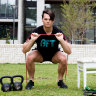 Fitness trainer Jeremy Tunkuna using some of his home equipment.