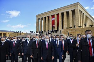 Turkish parliamentarians wearing face masks visit the mausoleum of Turkey's founder Mustafa Kemal Ataturk during a ceremony marking centennial celebrations for the founding of the Turkish parliament, which is also National Sovereignty and Children's Day, in Ankara, Turkey, Thursday, April 23, 2020. The government declared a four-day curfew in an attempt to control the spread of coronavirus.