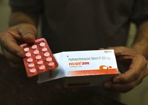 In this Thursday, April 9, 2020 file photo, a chemist displays hydroxychloroquine tablets in New Delhi, India