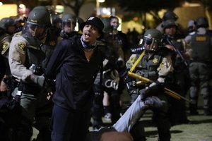 Demonstrators are arrested for a curfew violation Wednesday, June 3, 2020 in downtown Los Angeles during a protest over the death of George Floyd who died May 25 after he was restrained by Minneapolis police.