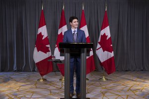 Canadian Prime Minister Justin Trudeau talks to journalists during a press conference after the 33rd ASEAN Summit in Singapore, Thursday, Nov. 15, 2018