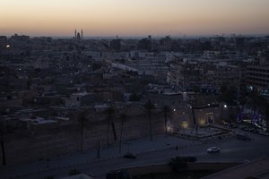 The walls surrounding the Old City are illuminated before sunrise in Tripoli, Libya