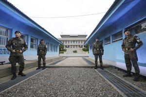 South Korean army soldiers stand guard during a rehearsal to mark the first anniversary of a summit between South Korean President Moon Jae-in and North Korean leader Kim Jong Un on April 27, at the border village of Panmunjom in the demilitarized zone (DMZ) between the two Koreas in Paju, South Korea, Friday, April 26, 2019.