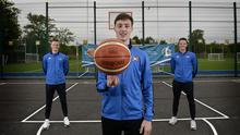 High hoops: CJ Fulton, Conor and Aidan Quinn at the new outside basketball courts at St Malachy's