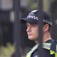 A police officer at the gates of Victoria University Secondary College in St Albans, where Solomone was a student, on Wednesday morning.