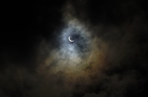 The sun is seen through rain clouds during solar eclipse in Hong Kong Sunday, June 21, 2020.