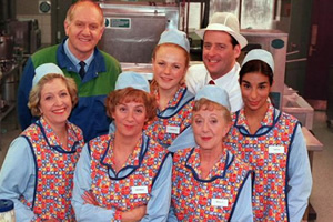 dinnerladies. Image shows from L to R: Jean (Anne Reid), Stan (Duncan Preston), Brenda (Victoria Wood), Twinkle (Maxine Peake), Dolly (Thelma Barlow), Tony (Andrew Dunn), Anita (Shobna Gulati). Copyright: Good Fun / Pozzitive Productions.