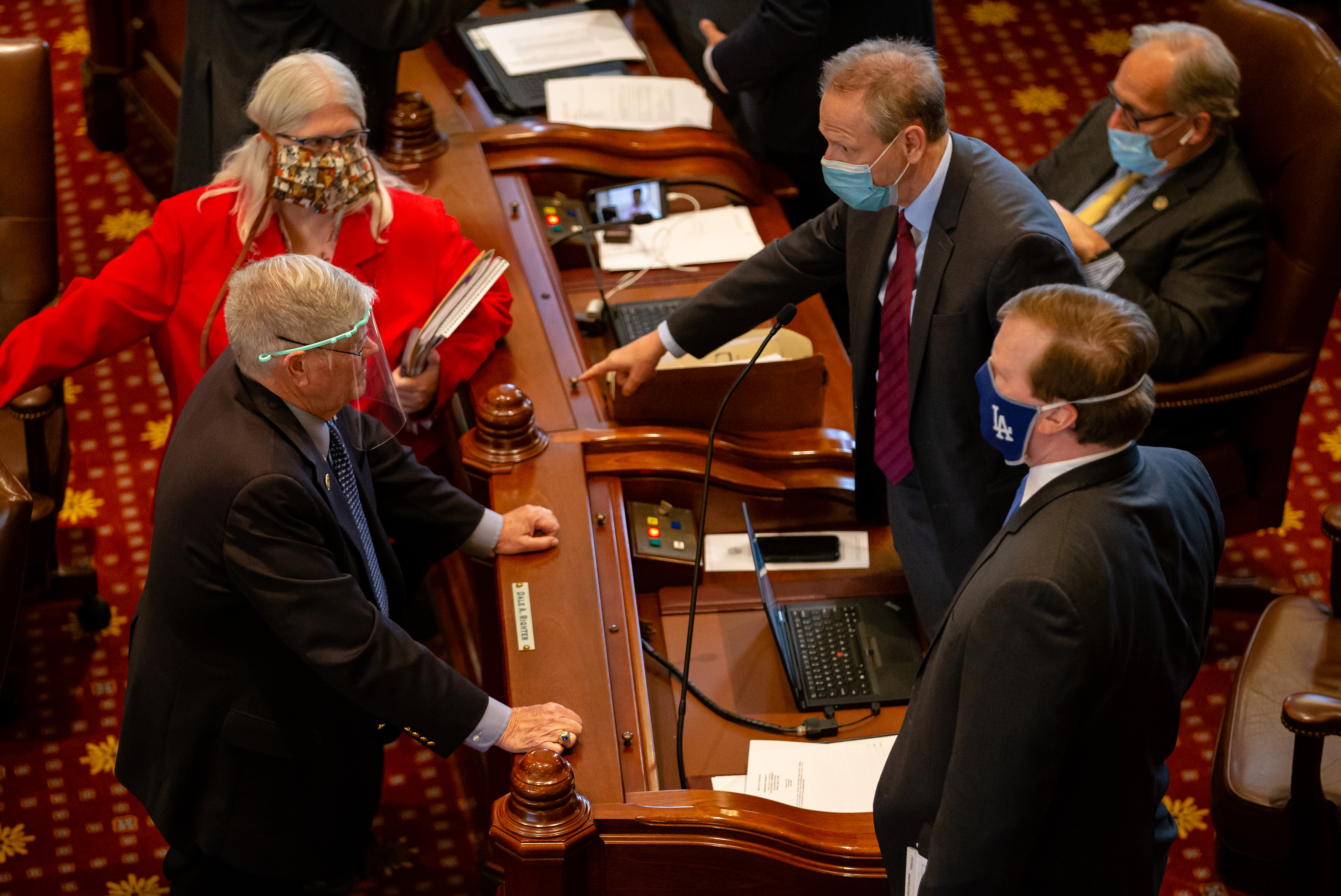 State Sen. Dale Righter, R-Mattoon, gestures as he talks with state Sen. Jim Oberweis, R-Sugar Grove,