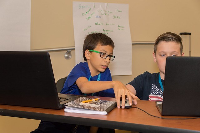 Two KidsCamp attendees working together and learning together