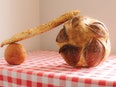 Bread on checkered tablecloth.