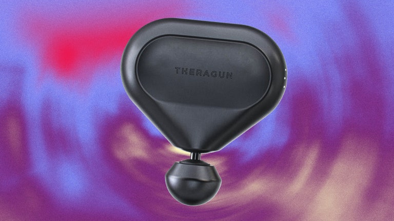 the theragun mini on a multicolored background