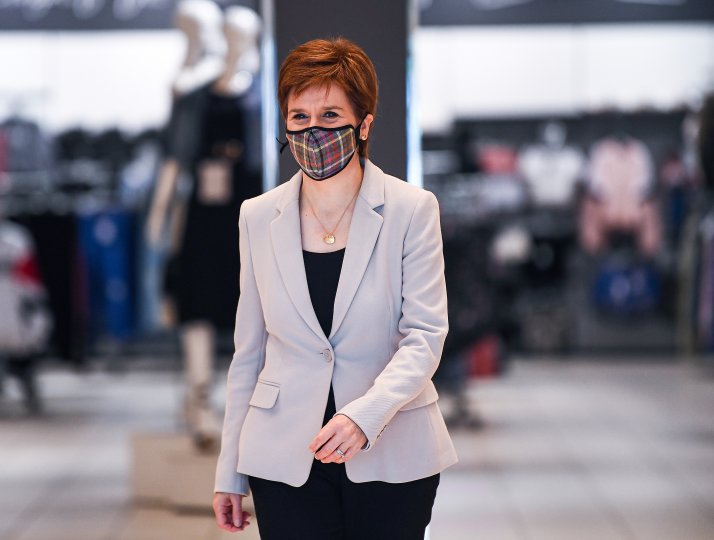 Nicola Sturgeon wears a tartan face mask as she visits New Look at Ford Kinnaird Retail Park on June 26, 2020 in Edinburgh.