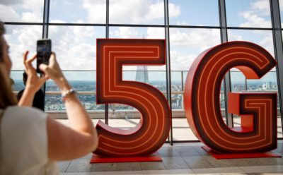 The 5G logo is pictured on a during the launch of Vodafone UK's 5G mobile data network in London.