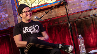 John Leguizamo on stage at the Comedy Center