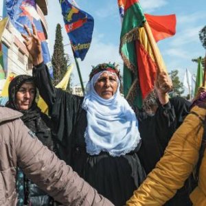 Women in Qamishlo, the de-facto capital of Rojava, protest against a Turkish-Russian deal that threatens them and the gains of their revolution. Delil Souleiman/AFP/Getty