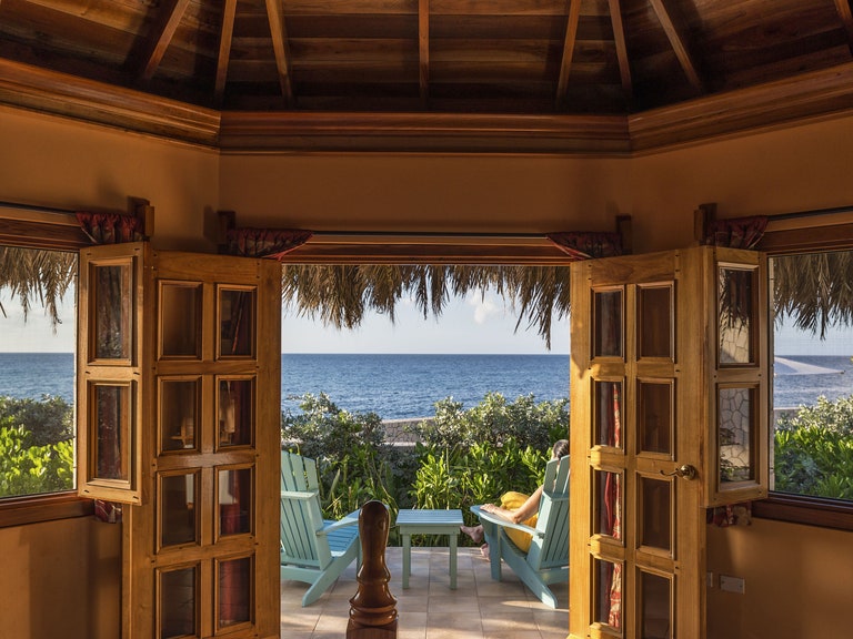 View of the ocean through doors at a tourist attraction in Jamaica 