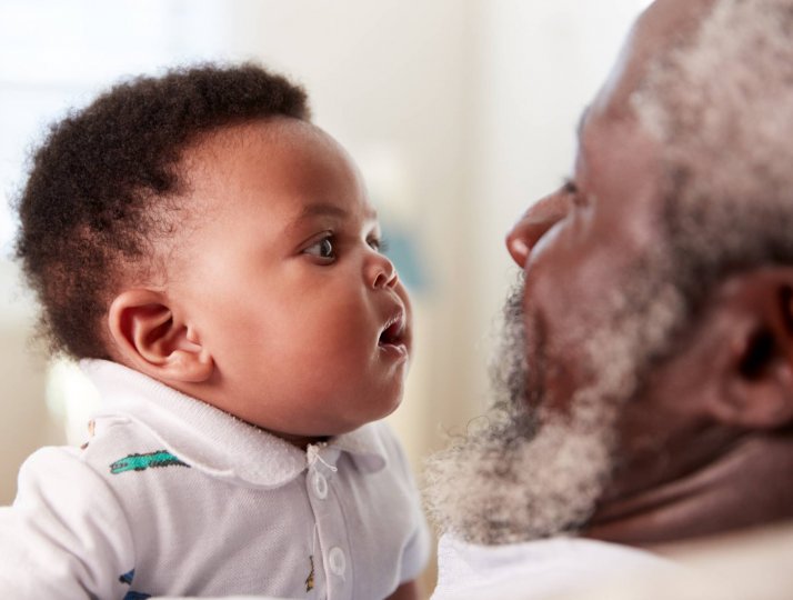 A baby and grandfather.